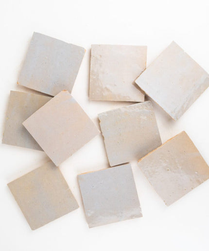 Set of square stone tiles on a white background