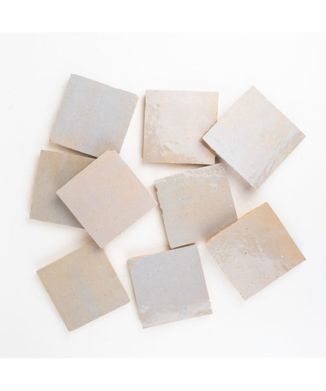 Neutral beige 4x4 zellige tiles with a glossy finish, ideal for backsplash or bathroom decor