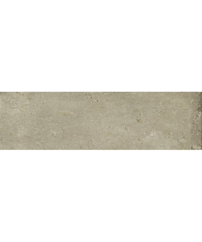 Rectangular beige ceramic tile with a textured, natural stone appearance