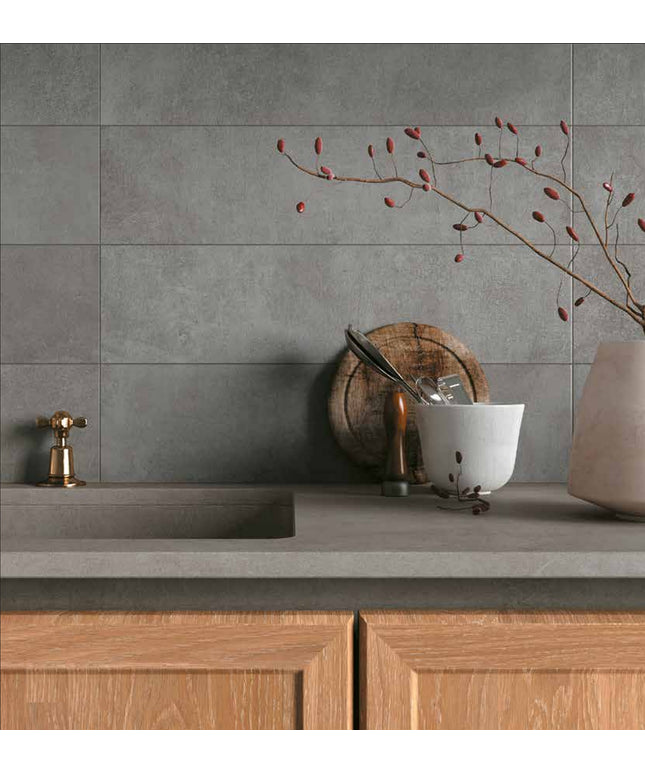 Matte gray wall tiles in modern kitchen backsplash with wood cabinets and decor