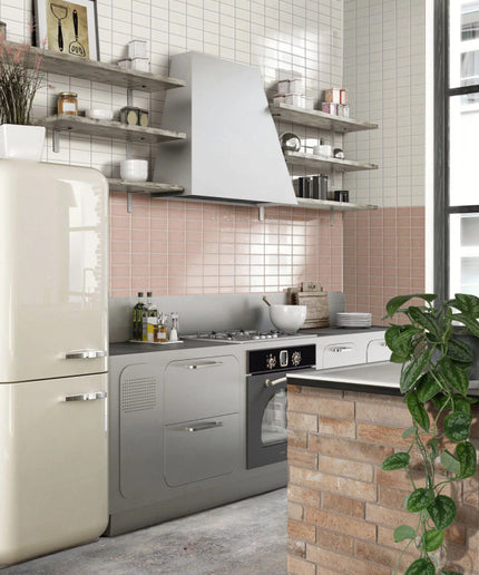 Modern kitchen with light pink backsplash tiles and white square wall tiles