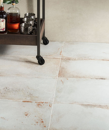 Tile floor with a bar cart in the background