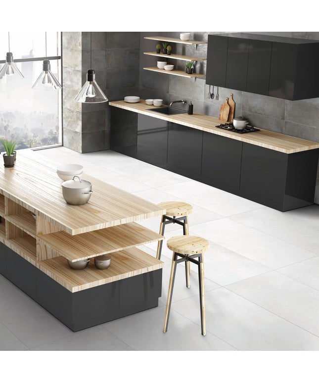Modern kitchen with black cabinets, wooden countertops, and stools.