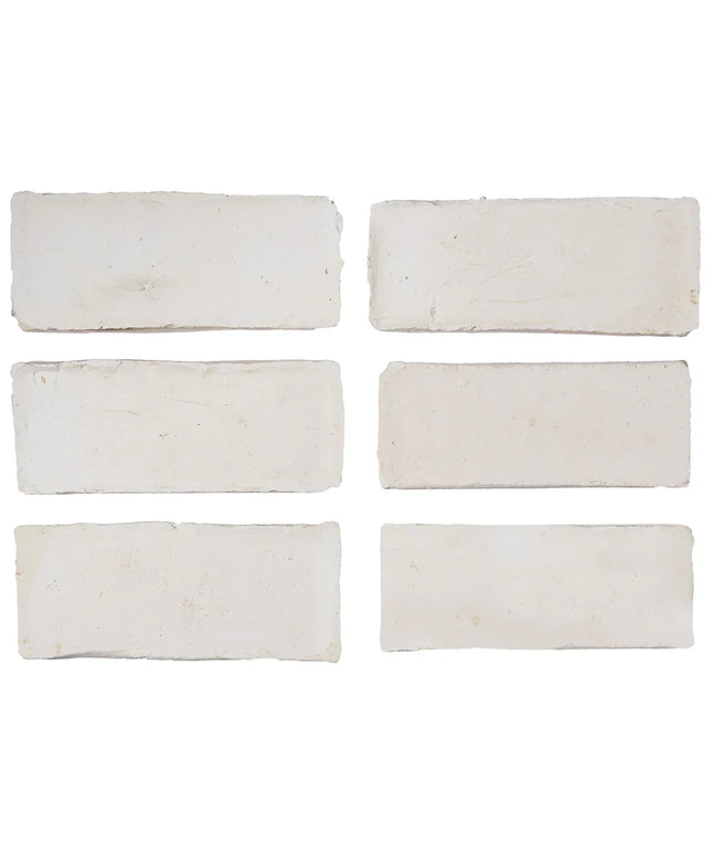 Set of six white rectangular tiles on a white background