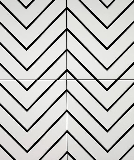 White ceramic tiles with black chevron pattern, modern geometric wall or floor tile design