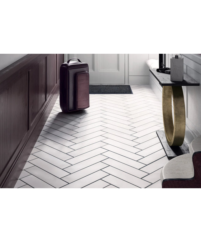 Modern interior with a suitcase on a white herringbone tile floor