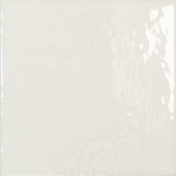 A square glossy ceramic tile in a warm off-white or cream color, showing subtle light reflections on its glazed surface.