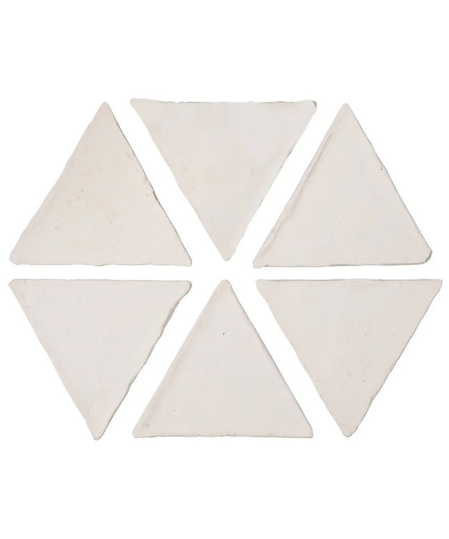 Set of six triangular white tiles on a white background