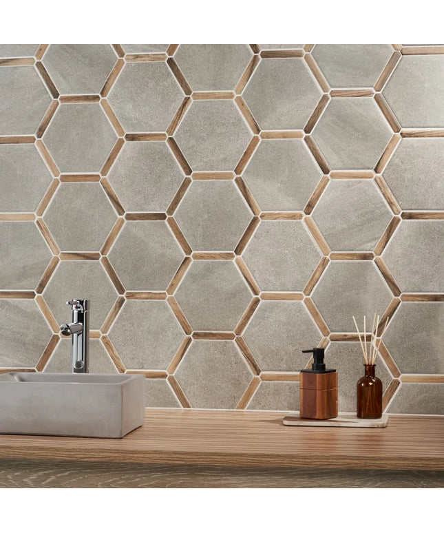 Bathroom with hexagonal tile pattern, sink, and decorative items.